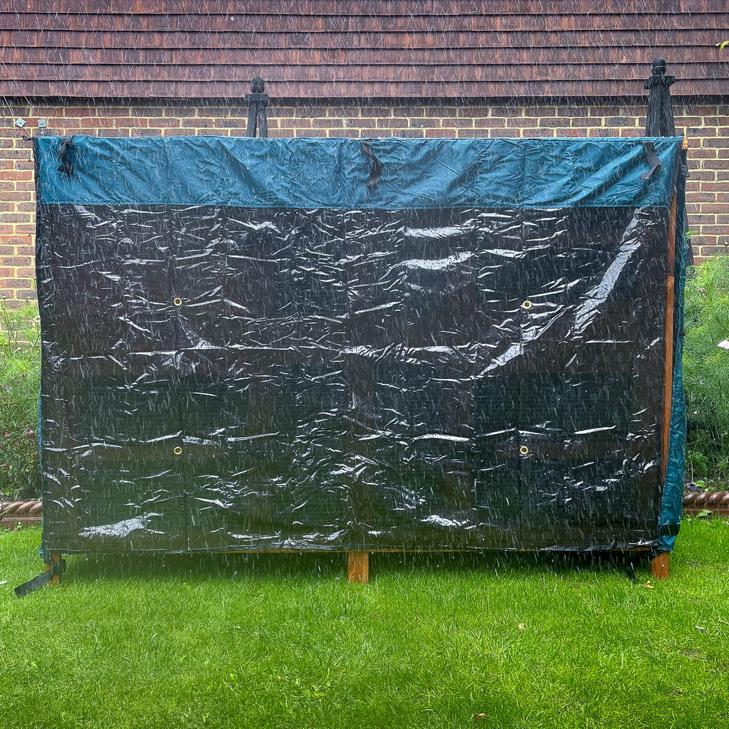 5ft double rabbit hutch rain cover day dry cover placed in a garden on a rainy day