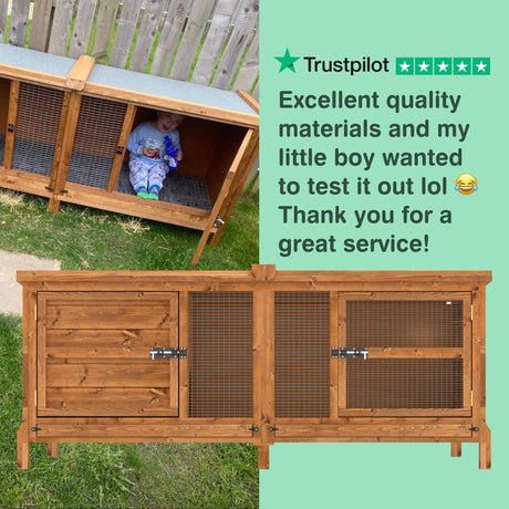 Wooden rabbit hutch enclosure with a child peeking out, set against a grassy background.