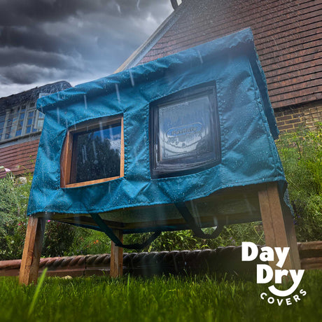 cat house rain cover in the garden under a cloudy sky