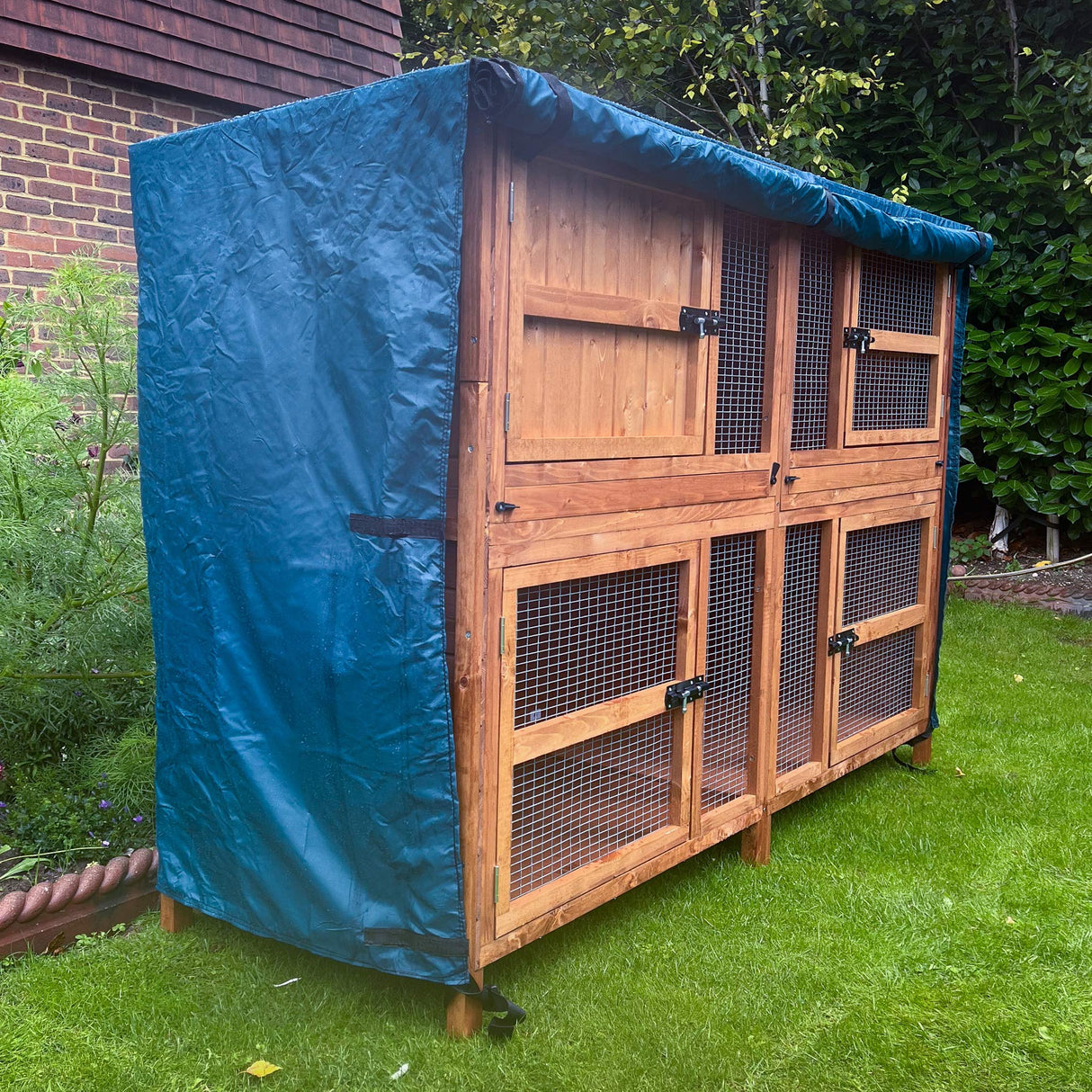 5ft guinea pig double 2 tier hutch rain cover front rolled up to gain access to doors