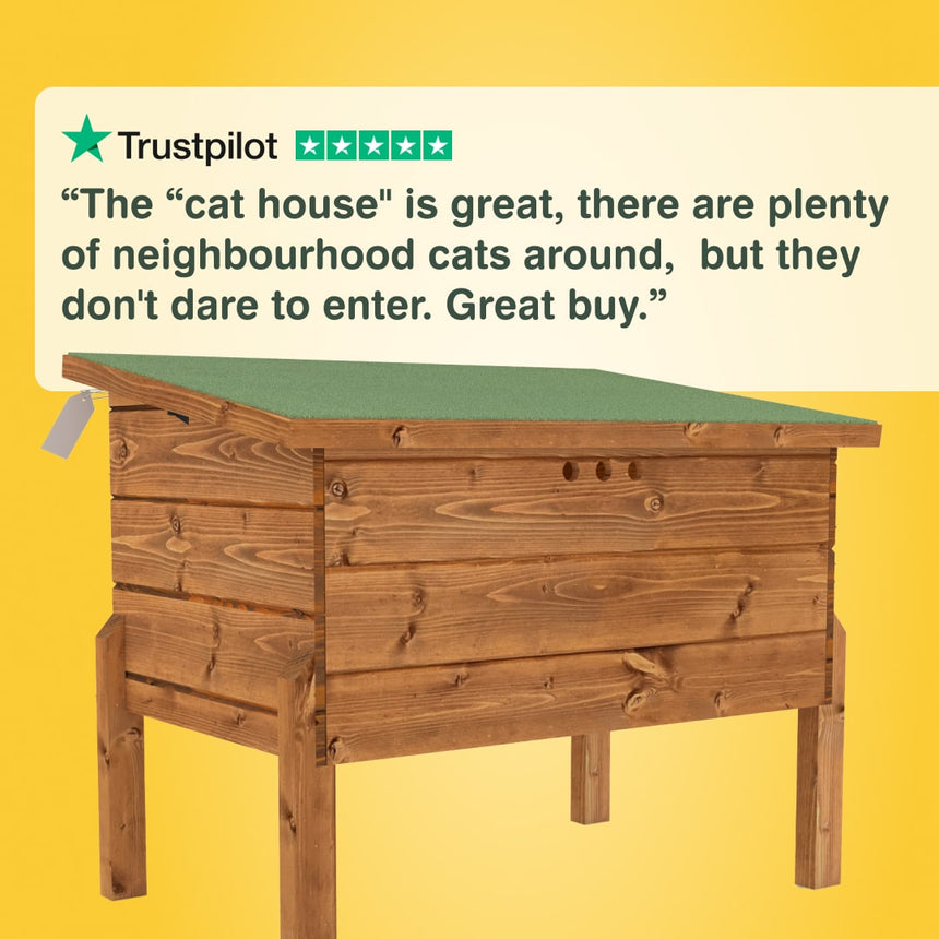 Wooden cat house with a yellow background and Trustpilot review text. “The “cat house" is great, there are plenty of neighbourhood cats around,  but they don't dare to enter. Great buy.”