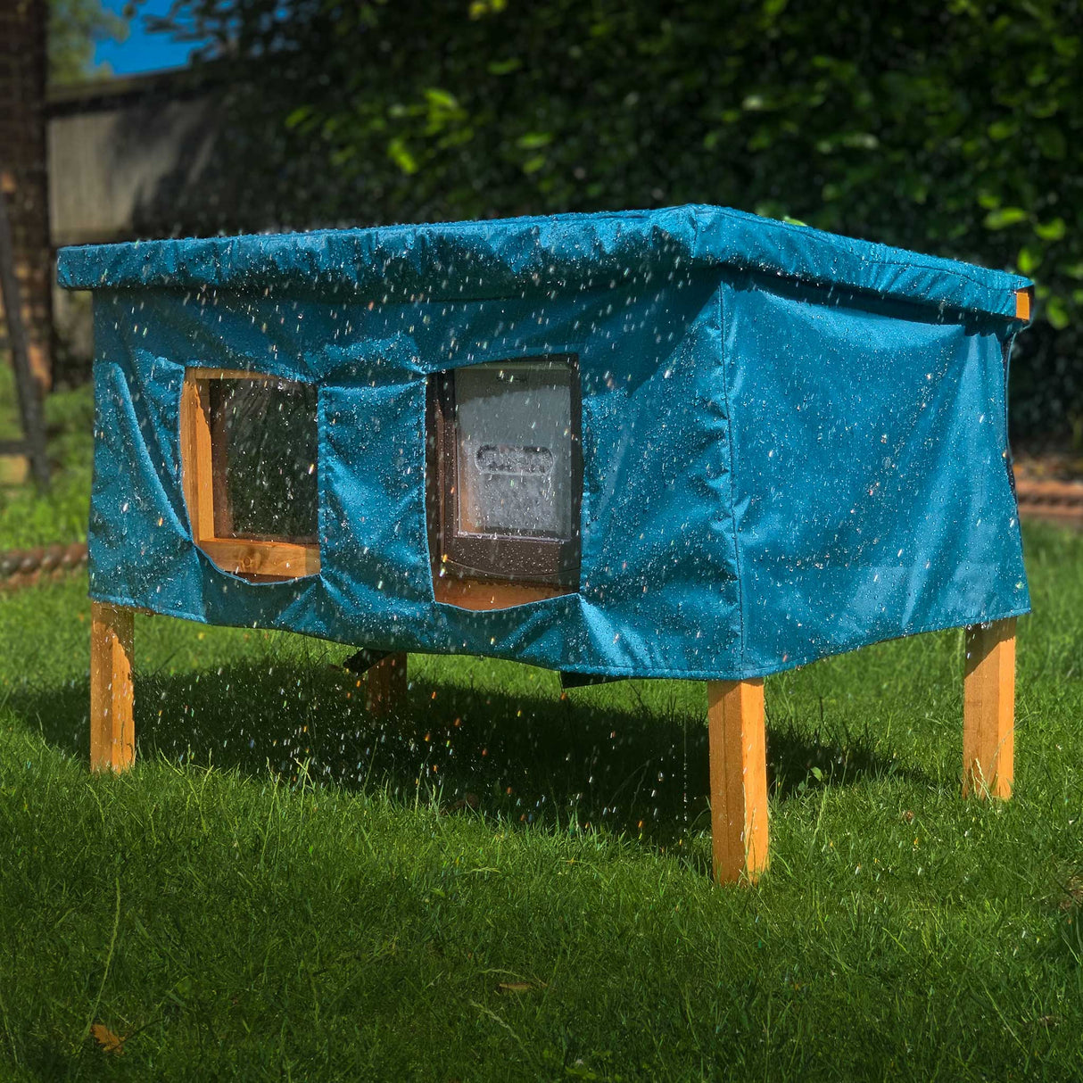 XL cat house rain cover in the garden under a cloudy sky water resistant