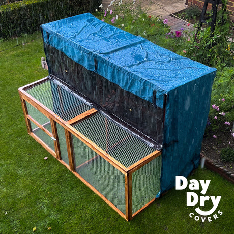 6ft kendal rabbit hutch cover and run in a wet rainy garden