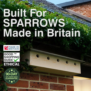 Wooden birdhouse on a brick wall with text 'Built For SPARROWS Made in Britain' and ethical certification logos.