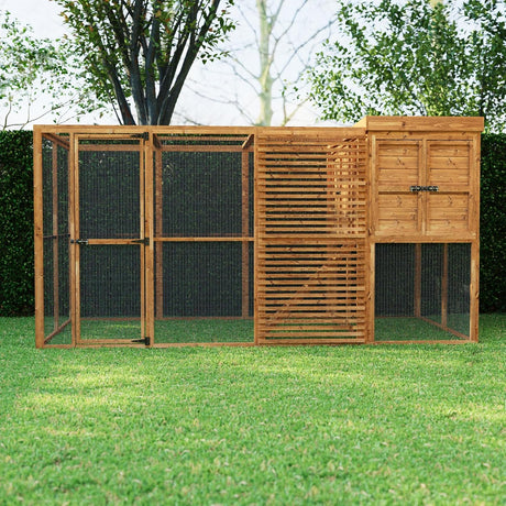 Walk in chicken coop with a door on a grassy area