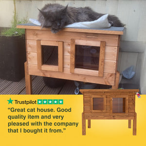 Wooden cat house with a cat on top, featuring a Trustpilot review. “Great cat house. Good quality item and very pleased with the company that I bought it from.”